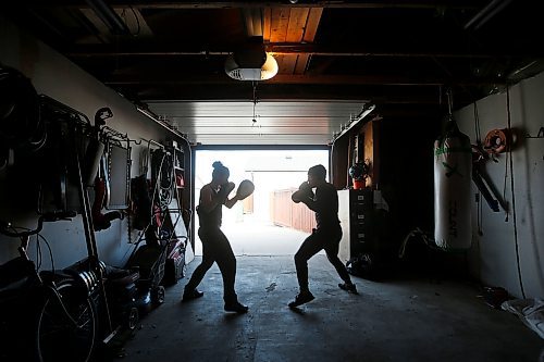 JOHN WOODS / WINNIPEG FREE PRESS

MMA fighter Brad Katona works out in his garage in Winnipeg with his girlfriend and fighter Katie Saull Wednesday, April 22, 2020. Katona was training in Ireland at Conor McGregor’s gym in Dublin. COVID-19 has shut everything down and Katona returned to Winnipeg to train.



Reporter: Allen