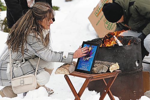 JOHN WOODS / WINNIPEG FREE PRESS

A woman touches a photo as just before putting tobacco in a fire at a memorial/celebration of life for musician Vince Fontaine at Oodena Circle at the Forks Sunday, January 16, 2022. 



Re: ?