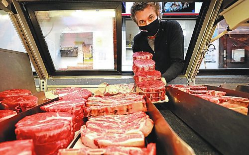 RUTH BONNEVILLE / WINNIPEG FREE PRESS 

Sunday Special - Cantor's Meats &amp; Groceries

Where: Cantor's Meats &amp; Groceries, 1445 Logan Ave.  owner Ed Cantor 

Photo of Ed Cantor with tray of roasts. 

What: This is for a two-page Sunday Special on Cantor's, approaching its 80th anniversary in biz; the grocery store continues to evolve, it partnered with Fresh Co. a couple of years ago - the meat dept. in some of the stores is run by Cantors - and they'll be entering a few more Fresh Co. locations this year.
 
Ed's grandfather started the biz in the early 1940s, after emigrating to Canada from Poland; he died young, a few years into the business, and his two son's, Ed's dad and uncle took over - both working there into until the day they died, literally. 

Ed, 56, has no plans to retire - he's hoping to be welcoming customers at least until the store turns 100, in 2042. 

For Sunday March 7 

March 02, 2021
