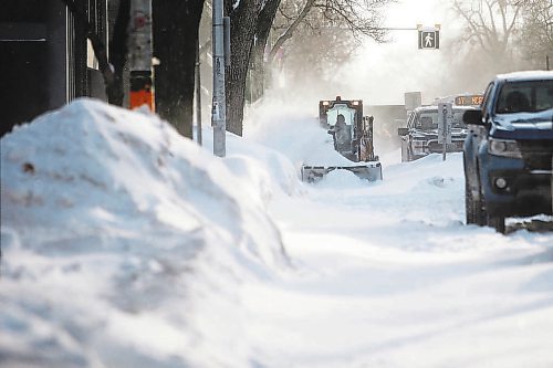 JOHN WOODS / WINNIPEG FREE PRESS

A city crew member plows a bike path on Sherbrook after a dump of snow, Tuesday, January 18, 2022. 



Re: standup