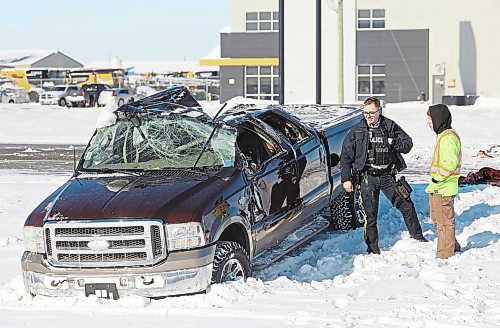 24012022
An eastbound truck lost control on a patch of ice on the Trans Canada Highway 1 KM west of Brandon and rolled into the ditch on Monday. No one was seriously injured in the rollover. (Tim Smith/The Brandon Sun)