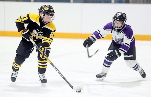 Reid Nicol of the Brandon 9A Wheat Kings evades the check of Brady Kisil of the River East Royals during the 2020 Tournament of Champions. The two-week hockey tournament was cancelled for the second year in a row on Tuesday. (Brandon Sun files)