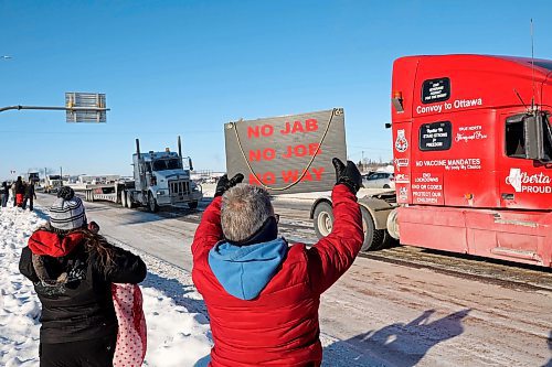 Hundreds of Westman residents braved the bitter cold in support of the trucker convoy as it made its way through Brandon on the Trans-Canada Highway Tuesday, demonstrating opposition to vaccine mandates. The group has been raising funds on GoFundMe, which has since told organizers they must present a clear plan for the funds before they can access them. (Tim Smith/The Brandon Sun)