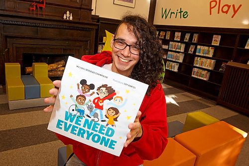 Michael Redhead Champagne shows off the cover of his children's book,&quot; We Need Everyone,&quot; which is available for pre-order. (Winnipeg Free Press)
