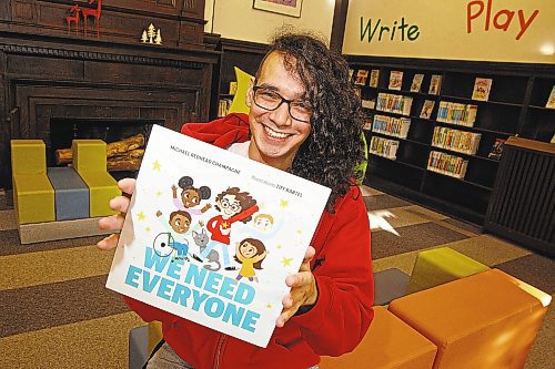 Michael Redhead Champagne shows off the cover of his children's book,&quot; We Need Everyone,&quot; which is available for pre-order. (Winnipeg Free Press)