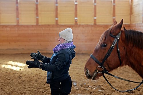 Taylor McEachern, head coach and partner at Phoenix Ranch Boarding Stables and Equestrian Centre, helps riders train on Thursday for this weekends Behlen Industries LP Icicle Schooling Show, presented by Westman Dressage. (Tim Smith/The Brandon Sun)