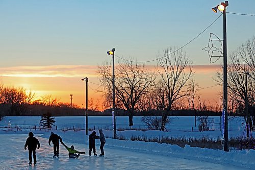 A few ice skaters brave the cold to enjoy the skating oval at sunset on Thursday. (Tim Smith/The Brandon Sun)