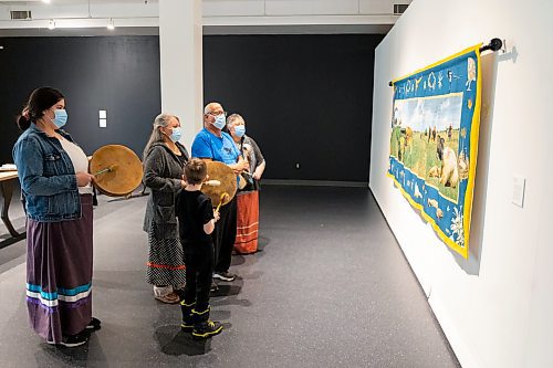 The Sweet Medicine Singers perform at the Art Gallery of Southwest Manitoba Thursday during the opening of artist Mary Anne Barkhouse&#x2019;s exhibit opimihaw. (Chelsea Kemp/The Brandon Sun)