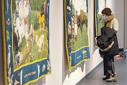 Guests explore the Art Gallery of Southwest Manitoba Thursday during the opening of artist Mary Anne Barkhouse’s exhibit opimihaw. (Chelsea Kemp/The Brandon Sun)