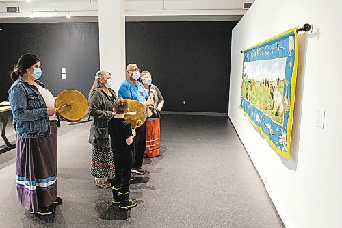 The Sweet Medicine Singers perform at the Art Gallery of Southwest Manitoba Thursday during the opening of artist Mary Anne Barkhouse’s exhibit opimihaw. (Chelsea Kemp/The Brandon Sun)