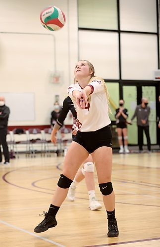 24012022
Dakota Burton #4 of the ACC Cougars bumps the ball during volleyball action against Providence University College at ACC on Friday evening. (Tim Smith/The Brandon Sun)