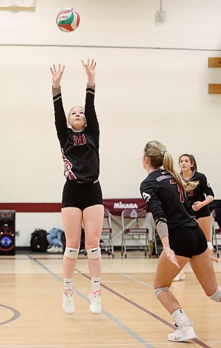 24012022
Billie Bootsman #10 of the ACC Cougars sets the ball during volleyball action against Providence University College at ACC on Friday evening. (Tim Smith/The Brandon Sun)