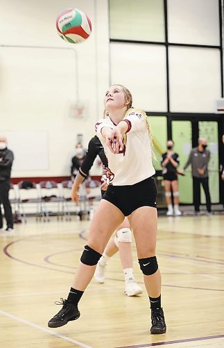 24012022
Dakota Burton #4 of the ACC Cougars bumps the ball during volleyball action against Providence University College at ACC on Friday evening. (Tim Smith/The Brandon Sun)