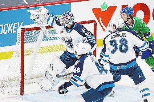 JOHN WOODS / WINNIPEG FREE PRESS

Manitoba Moose goaltender Arvid Holm (35) moves to cover up the loose puck during first period AHL action against the Abbotsford Canucks in Winnipeg on Sunday, January 30, 2022.



Reporter: Allen