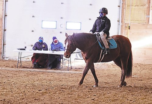 Asher Smart attempts to cross the arena on a straight line as per instruction on Joy as scribe Lori Versavel (left) and judge Shirley Neudorf (right) observe at Phoenix Ranch just south of Brandon for the Westman Dressage Behlen Industries LP Icicle Schooling Show Series. (Photos by Karen McKinley/The Brandon Sun) 