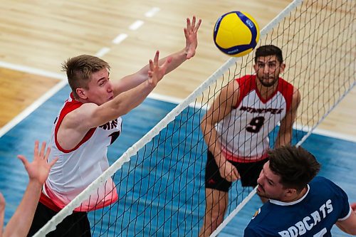 University of Winnipeg Wesmen middle Liam Kristjanson blocks an attack from the Brandon University Bobcats in their Canada West men's volleyball match at the Healthy Living Centre on Saturday. (Chelsea Kemp/The Brandon Sun)