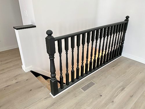 Photos by Marc LaBossiere / Winnipeg Free Press
The homeowner desired a high-contrast stairwell that includes a banister with satin black finish, encased by white trim along the base.
