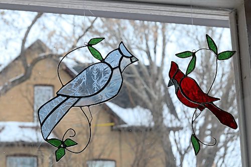 The process of making these stained-glass birds can take anywhere from one to several hours based on the type of glass they cut and tracing the pattern to their exact likeness. (Joseph Bernacki/The Brandon Sun)