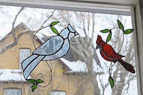 The process of making these stained glass birds can take anywhere from one to several hours based on the type of glass they cut and tracing the pattern to their exact likeness. (Joseph Bernacki/The Brandon Sun)