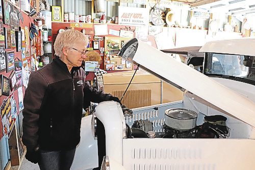 Balanyk checks in on the 350 Chevrolet motor that powers her modified 1934 Ford pickup truck. (Kyle Darbyson/The Brandon Sun)