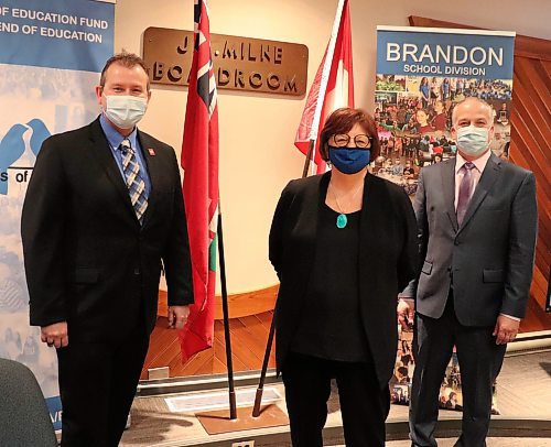 Education Minister Wayne Ewasko (left) poses for a photo with Brandon School Division chairperson Linda Ross and Supt. Mathew Gustafson Friday afternoon at BSD headquarters, shortly after the minister unveiled provincial funding for the 2022-23 school year. (Kyle Darbyson/The Brandon Sun)