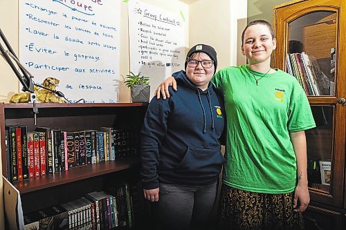 Katimavik participants Hannah Lyon (left) and Meaghan Foster stand in the living room of their program's house Friday. (Chelsea Kemp/The Brandon Sun)