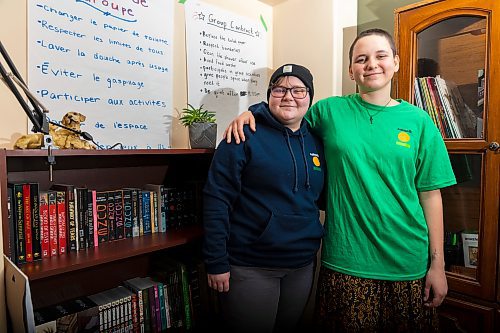 Katimavik participants Hannah Lyon (left) and Meaghan Foster stand in the living room of their program's house Friday. (Chelsea Kemp/The Brandon Sun)