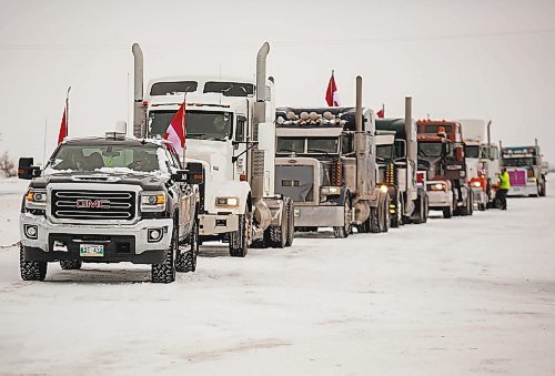 Vehicles participate in a slow-roll truck convoy in Brandon on Saturday. The protest was in support of truckers in Ottawa pushing for the end of COVID-19 mandates. The group of several dozen vehicles, including semis, departed from the North Hill Tim Hortons and ended at the Victoria Inn parking lot &#x2014; it was originally scheduled to drive to Portage la Prairie but was re-routed due to poor road conditions. (Photos by Chelsea Kemp/The Brandon Sun)