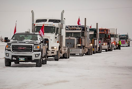 Vehicles participate in a slow-roll truck convoy in Brandon on Saturday. The protest was in support of truckers in Ottawa pushing for the end of COVID-19 mandates. The group of several dozen vehicles, including semis, departed from the North Hill Tim Hortons and ended at the Victoria Inn parking lot — it was originally scheduled to drive to Portage la Prairie but was re-routed due to poor road conditions. (Photos by Chelsea Kemp/The Brandon Sun)
