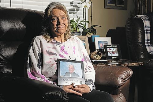 Marlene Blake holds a photo of her husband Rick who died in 2021. (Chelsea Kemp/The Brandon Sun)