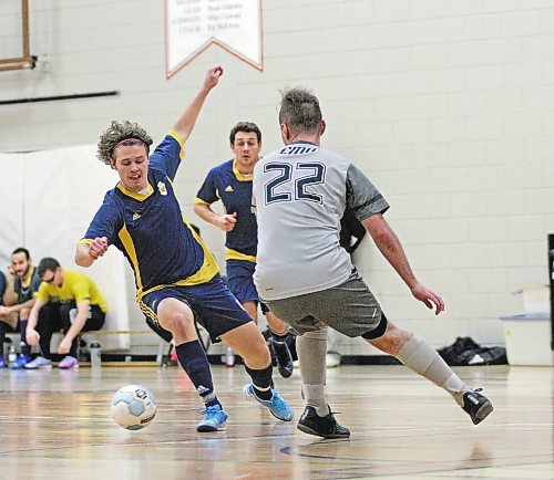 Brandon University Bobcats Zach Wood dribbles against Canadian Mennonite University's Will Anderson during their Manitoba Colleges Athletic Conference men's futsal game at Henry Champ Gymnasium on Sunday. (Thomas Friesen/The Brandon Sun)