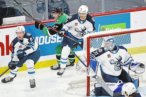 JOHN WOODS / WINNIPEG FREE PRESS

Manitoba Moose Johnathan Kovacevic (4), centre, plays against the Texas Stars in downtown Winnipeg, Sunday, February 6, 2022. 



Re: McIntyre