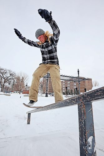 Tanner Kitson of Rapid City frontside board-slides a rail at the Kristopher Campbell Memorial Skatepark in Brandon while snow-skating with his brother Quintin on Monday. (Tim Smith/The Brandon Sun)