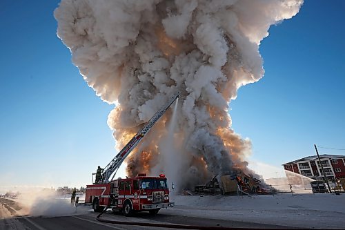 Brandon Fire and Emergency Services members battle a large fire that destroyed an apartment complex under construction at 4110 Victoria Ave. in the city's west end on a bitterly cold Thursday morning. Smoke from the blaze could be seen from across the city as it towered up into the clear sky. (Tim Smith/The Brandon Sun)