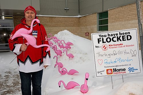 Kinsmen Club of Brandon chair John DeBeer, aka FlockmasterJ, showcases flamingos outside Brandon Regional Health Centre Saturday. (Chelsea Kemp/The Brandon Sun)