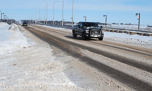 The First Street bridge was cleared and sanded by late Sunday morning after Saturday night's blizzard conditions, but the northbound and southbound lanes leading from the Trans-Canada Highway were icy. (Karen McKinley/The Brandon Sun)