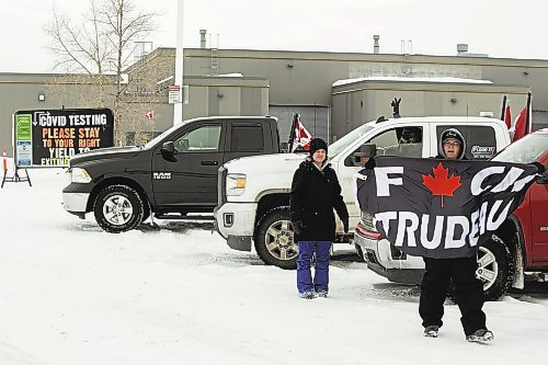 Freedom Convoy protesters park at the COVID-19 testing site located at the Manitoba Emergency Services College Parking lot Saturday. (Chelsea Kemp/The Brandon Sun)