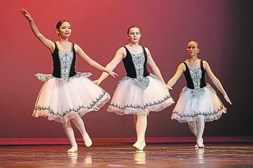 SPARKLE MOTION: Madelyn Albert, left, Alyx Doyle and Xylia Crossman perform in the ballet session of the Steppin&#x2019; Time Dance Studios 2022 Showcase. The Showcase takes place over four days and features more than 200 performances in front of a live audience for the first time in two years. The next session will take place on Thursday and features stage dance and jazz. On Friday the showcase will feature tap dancing and the event concludes Saturday with a ballet, pointe, lyrical, modern, acro and hip hop performances. (Chelsea Kemp/The Brandon Sun)