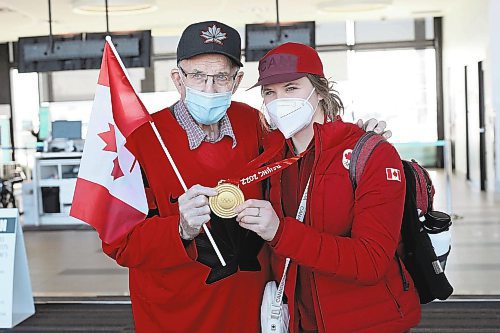Brandon Sun 22022022

Local Olympian Kristen Campbell takes photos with her grandfather Bill Miller after arriving at the Brandon Municipal Airport on Tuesday. Campbell won a gold medal as part of Team Canada's women's hockey team at the Olympic Games Beijing 2022. 

(Tim Smith/The Brandon Sun)