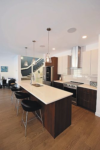 Todd Lewys / Winnipeg Free Press
Anchored by a 10-foot island, the kitchen is a striking yet highly functional space.