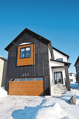 Photos by Todd Lewys / Winnipeg Free Press

A grand modern farmhouse exterior gives this large two-storey plan by Signature Homes loads of curb appeal.

