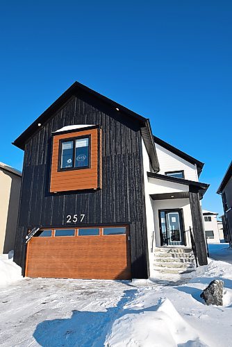 Photos by Todd Lewys / Winnipeg Free Press

A grand modern farmhouse exterior gives this large two-storey plan by Signature Homes loads of curb appeal.

