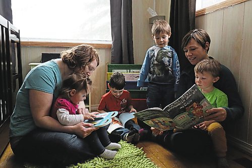 Left to right; Chantal Peters and her two children Annabeth and Jayden, share a reading circle with Elizabeth Cancade and her two sons Rafael and Ludo. (Joseph Bernacki/The Brandon Sun)