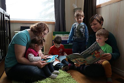 (From left) Chantal Peters and her two children Annabeth and Jayden, share a reading circle with Elizabeth Cancade and her two sons Rafael and Ludo. (Joseph Bernacki/The Brandon Sun)