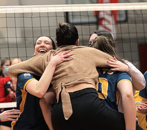 Rayvn Wiebe, left, celebrates the win that guaranteed her a .500-or-better record for the first time in her Canada West women's volleyball career at the Duckworth Centre on Saturday. (Photos by Thomas Friesen/The Brandon Sun)