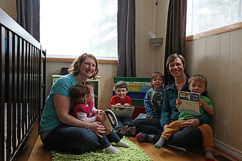 (From left) Chantal Peters and her two children Annabeth and Jayden, share a reading circle with Elizabeth Cancade and her two sons Rafael and Ludo. (Joseph Bernacki/The Brandon Sun)