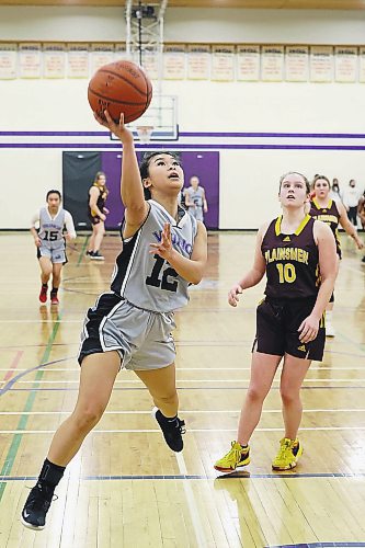 24022022
Annie Tan #12 of the Vincent Massey Vikings leaps to let off a shot on net during game two of the best of three varsity girls basketball city final against the Crocus Plainsmen at VMHS on Thursday evening. (Tim Smith/The Brandon Sun)
