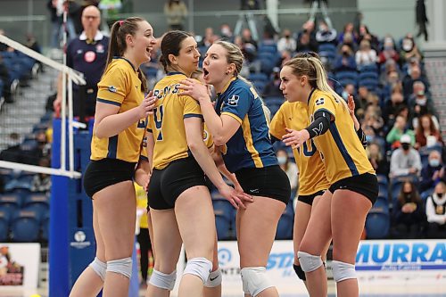 Brandon Bobcats players celebrate a point during university women's volleyball action against the University of Regina Cougars at the BU Healthy Living Centre on Friday evening. (Tim Smith/The Brandon Sun)