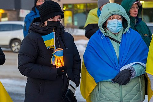 Community members gather in front of Brandon City Hall Friday in support of Ukraine. (Chelsea Kemp/The Brandon Sun)