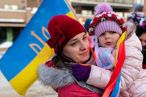 headline: A COMMUNITY UNITED

caption: Liudmyla holds Kristina Kardash in front of Brandon City Hall Friday during a rally in support of Ukraine. The country was invaded by Russian forces Thursday. See the full story and more photos on Page A3. (Chelsea Kemp/The Brandon Sun)